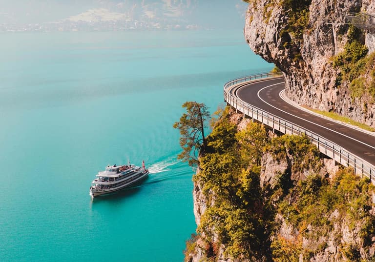Boatpassingcliff side image
